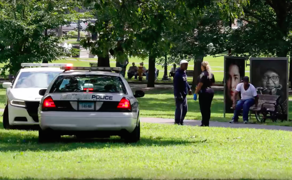 Police officers canvassing New Haven Green