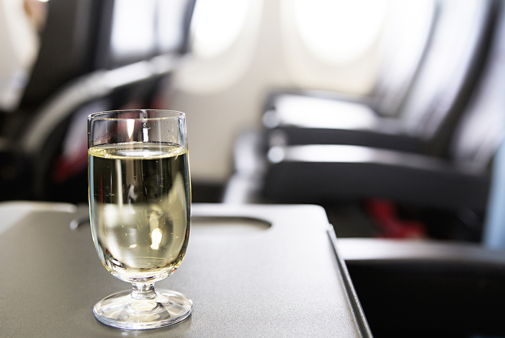 glass of wine on flight