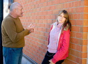 Father talking to teenage daughter