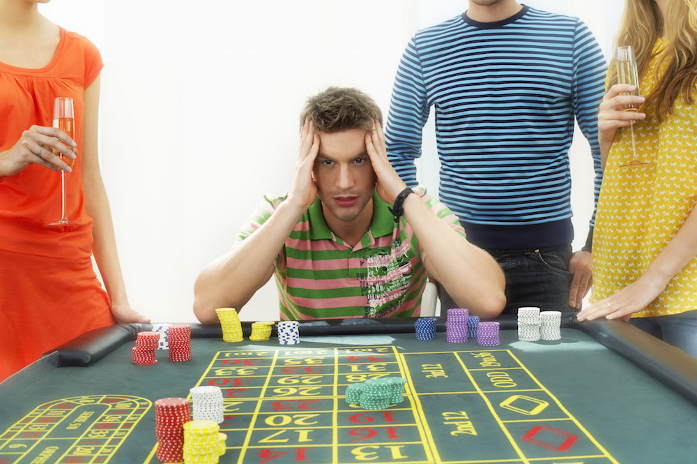 frustrated man at roulette table