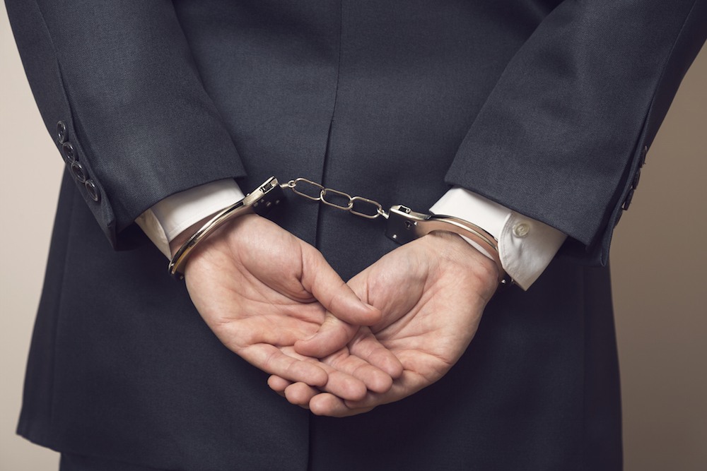 businessman in handcuffs