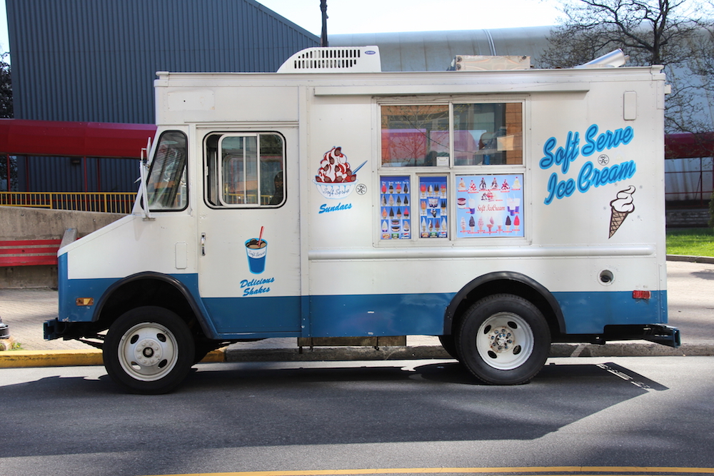 ice cream truck parked by curb