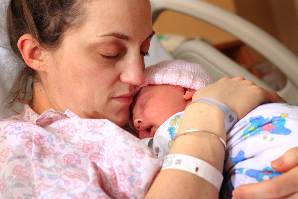 new mother holding a newborn