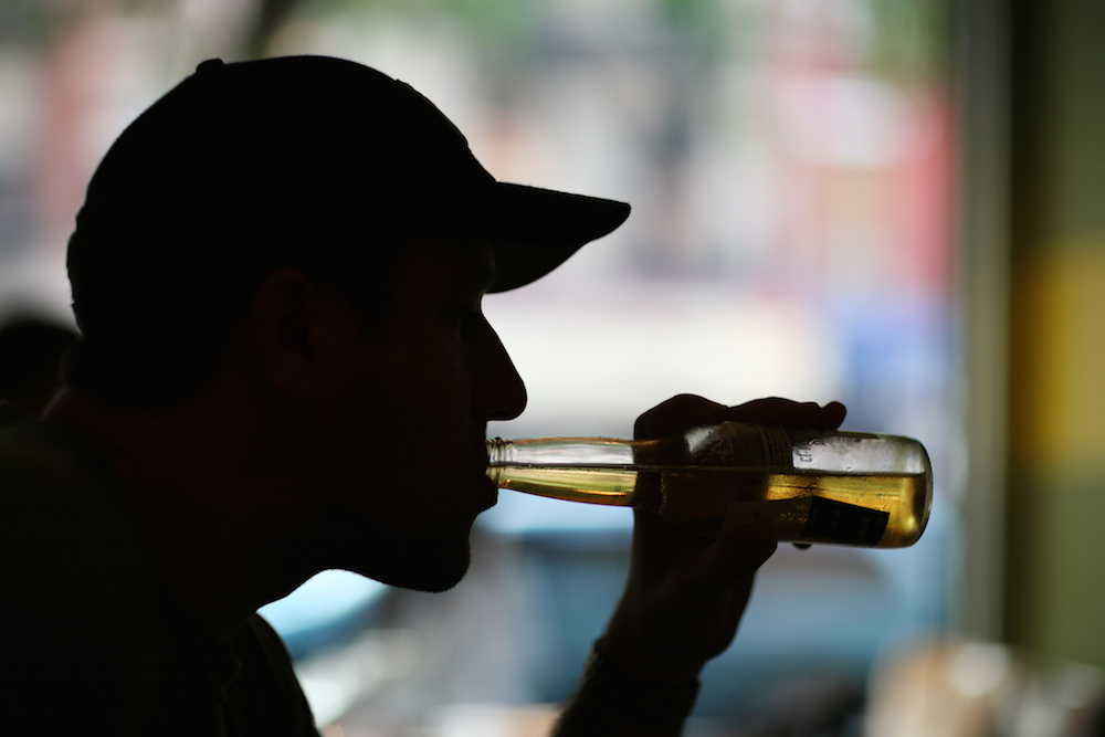 man drinking a beer