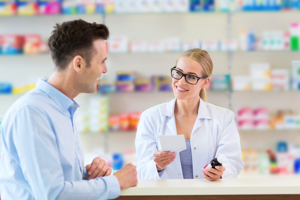 pharmacist talking to customer
