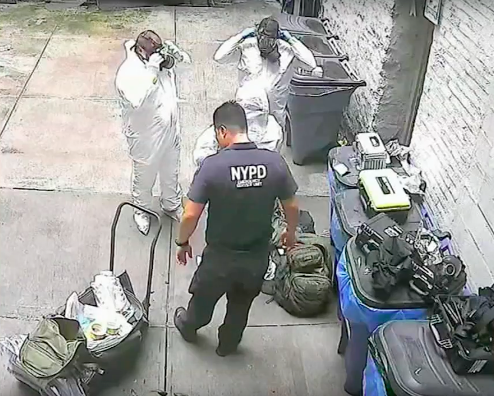 Authorities standing outside of the vacant, drug-filled unit.