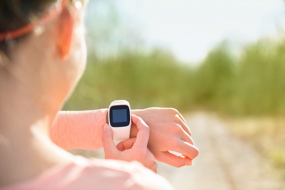 woman checking a smartwatch