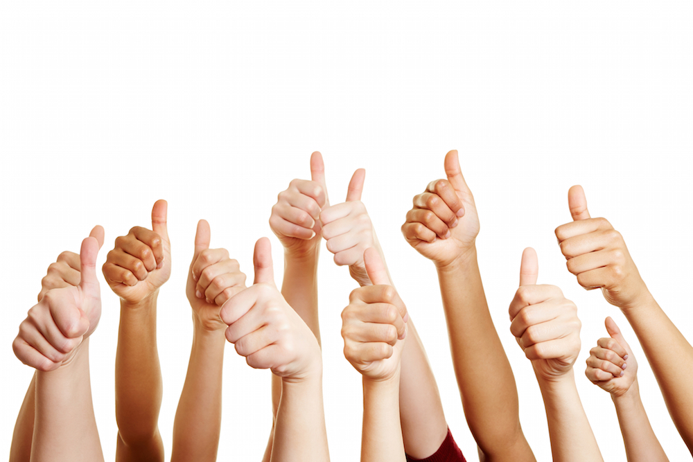 group of hands giving thumbs up