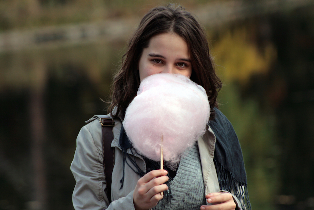 woman eating cotton candy which was mistaken for meth by faulty drug test