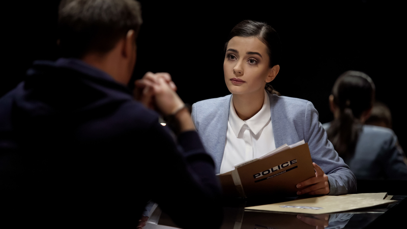 female lawyer meeting arrested man, preparation for court hearing