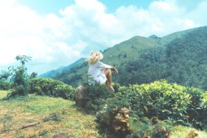Woman on rock in Sri Lanka; mindfulness meditation