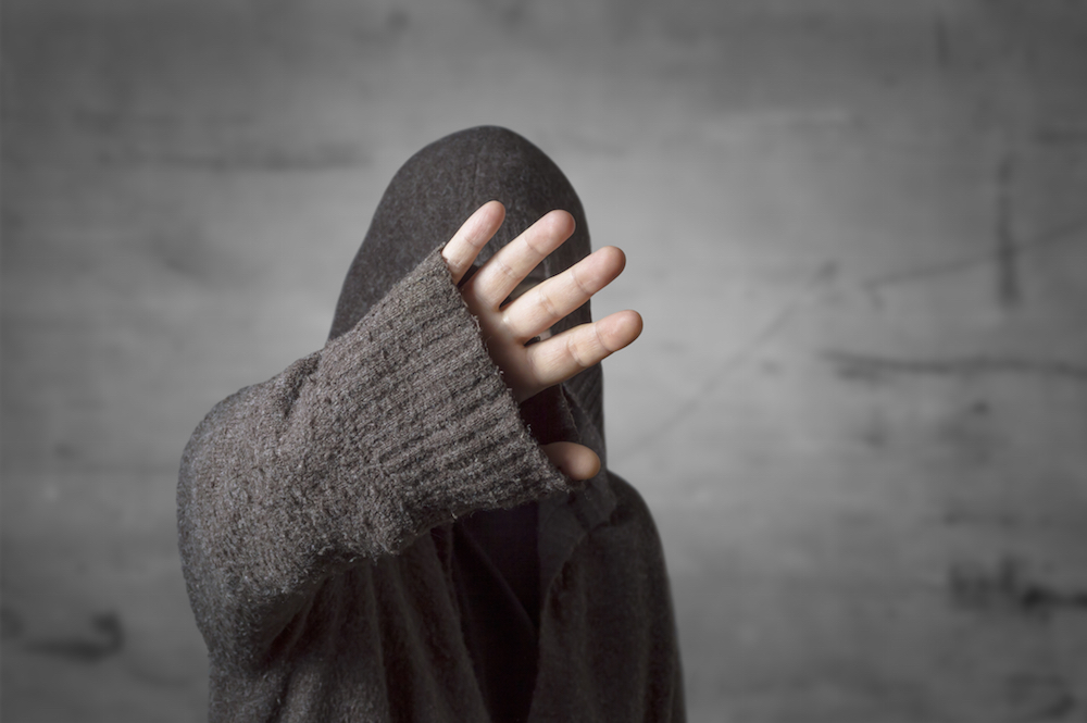 overdose survivor who went viral puts hand up to block face from camera