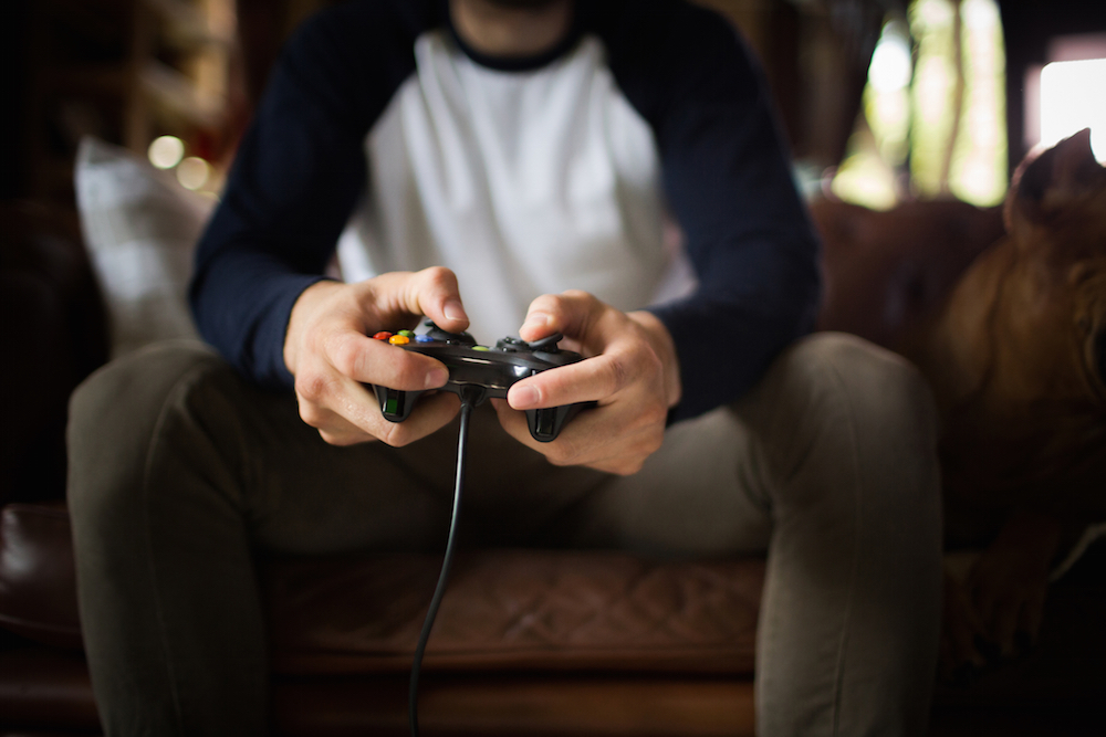 man with video game addiction playing game