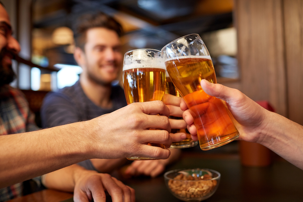 man ordering beer after drinking hard liquor