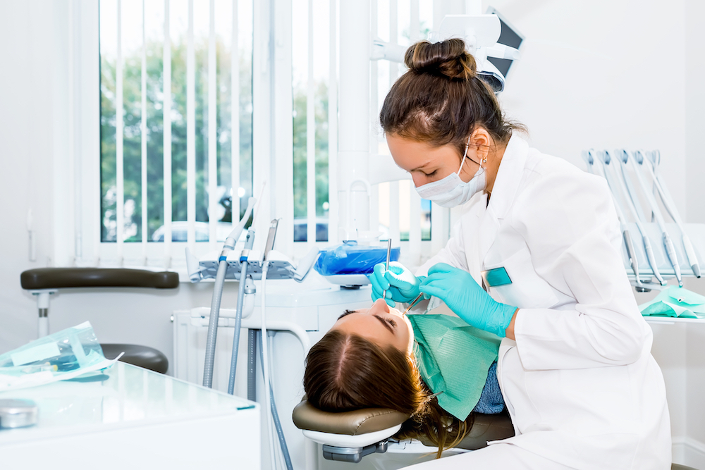 a dentist working on a patient