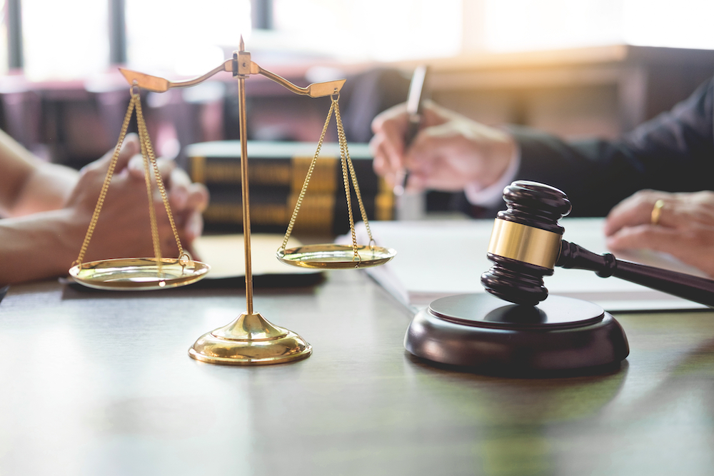 lawyers discussing the possibility of bankruptcy over Oxycontin lawsuits