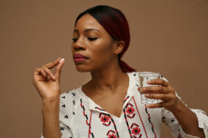 a woman holding an opioid painkiller