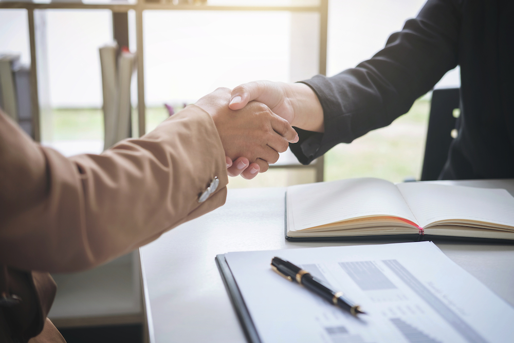 Drug Policy Alliance board member shaking hands with another
