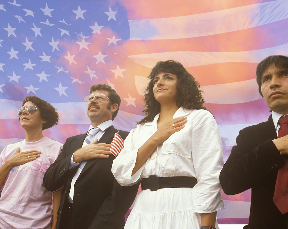 Group of people participating in a US citizenship ceremony
