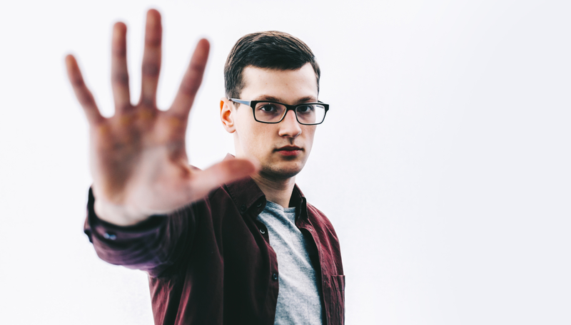 Man holding up hand with fingers outstretched, indicating 5 years of sobriety