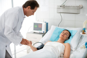 doctor checking on woman in deep coma for depression treatment