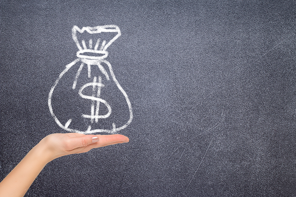 hand holding fictional bag of money for opioid response funding