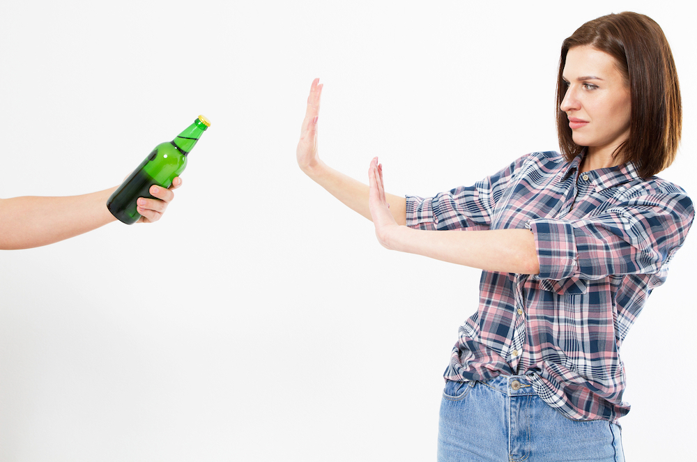 sober woman saying no to alcohol