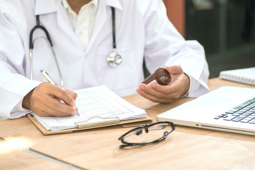 Ohio doctor writing prescription for medical marijuana