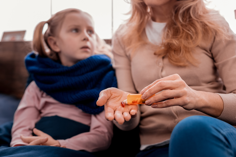a parent giving a sick child prescription opioids