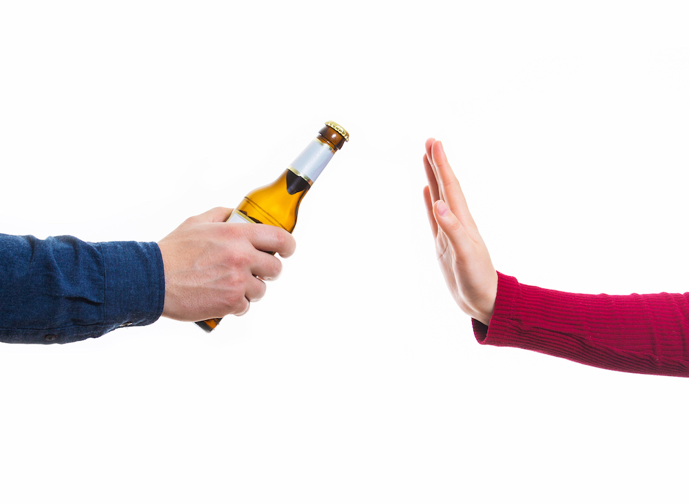 sober curious person saying no to a drink