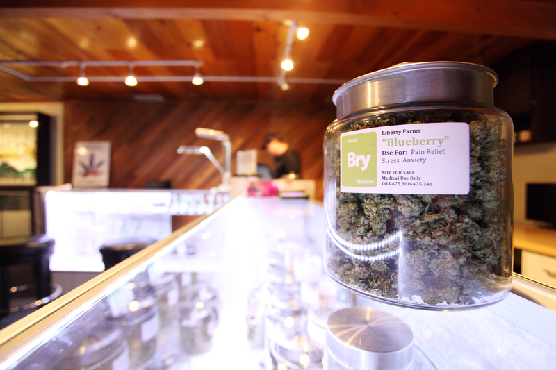 Medical marijuana in a large jar at a legal marijuana dispensary.