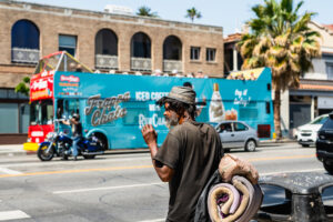 LA man without housing about to cross the street