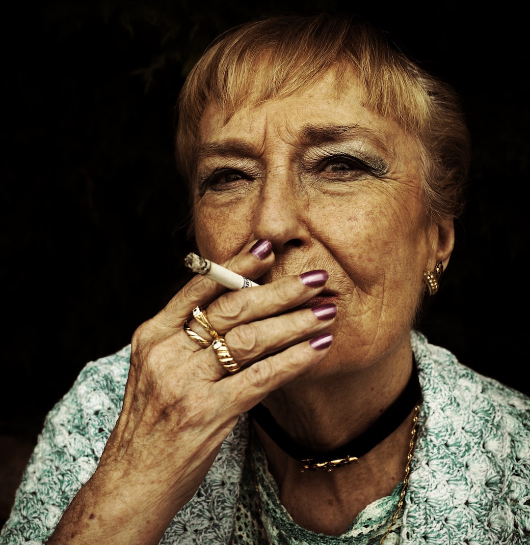 Older woman smoking cigarette