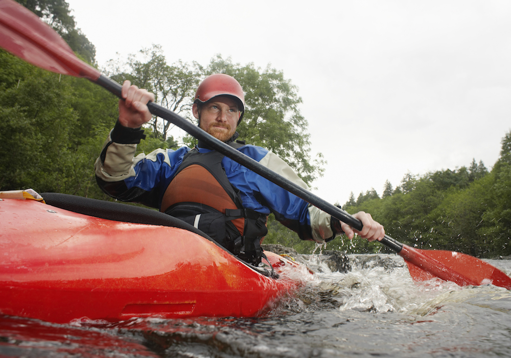 man kayaking
