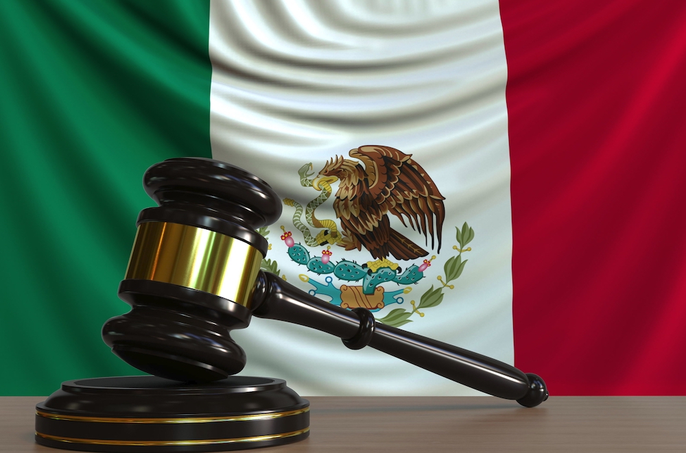 gavel in front of Mexico's flag