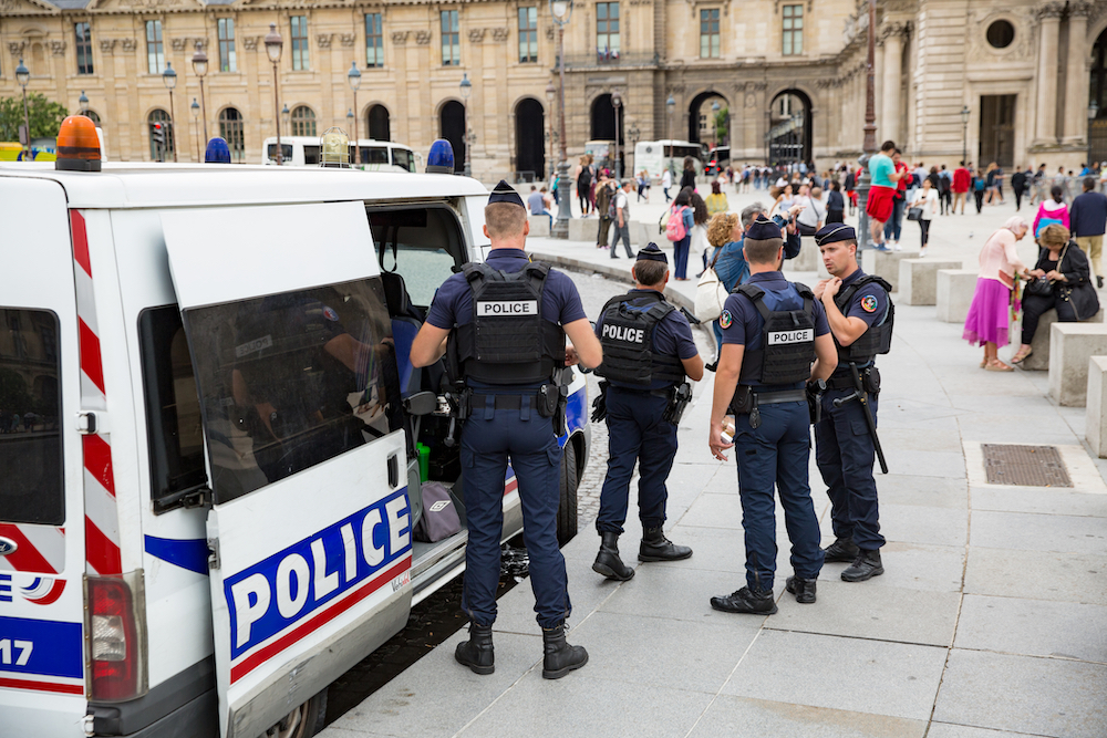 police patrolling area near open-air crack market in Paris