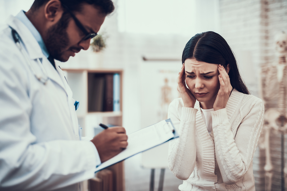 doctor in india helping a patient