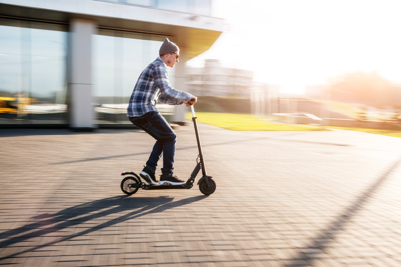 man riding electric scooter