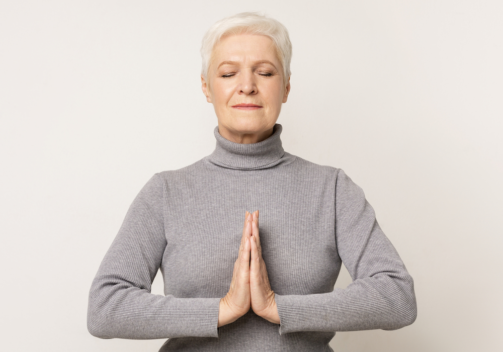older woman meditating