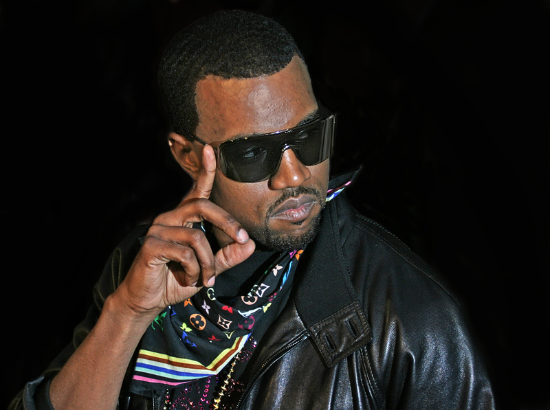 Kanye west sporting shades and a leather jacket