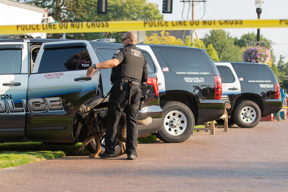 police k9 unit preparing to search a car for marijuana