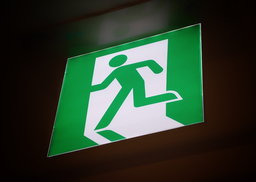 exit sign showing green stickman exiting