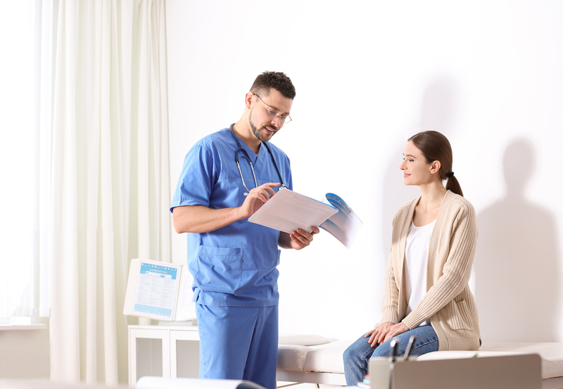 Doctor and smiling patient in office.