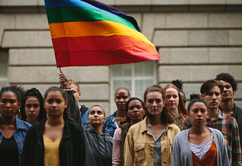 Group of people with Pride flag