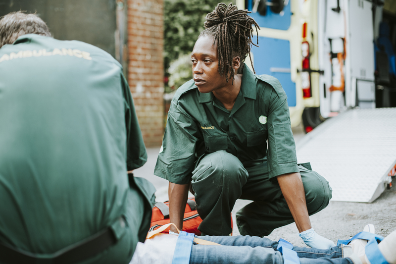 paramedics with stretcher, at work